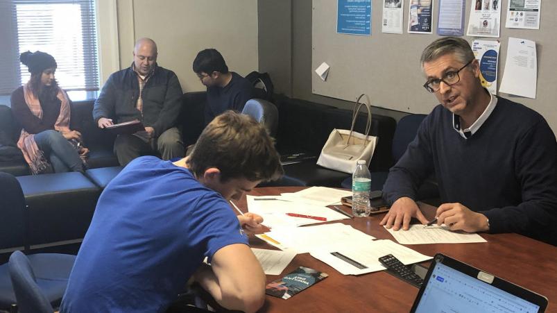 Inaugural Executive in Residence Matt Laszlo'92 (left) working with creative students in the course Navigating Your (Business) ...
